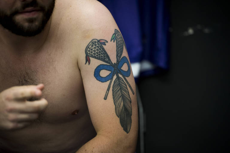 FILE Ñ Jake Fox of the Haudenosaunee Nationals menÕs lacrosse team shows off a tattoo, during the World Games in Birmingham, Ala., on July 11, 2022. This Native American team, which has won medals at the world championships, is not currently eligible for the 2028 Summer Games in Los Angeles because it does not represent a recognized nation. (Pete Kiehart/The New York Times)