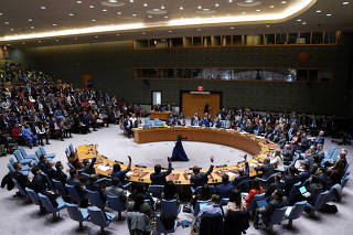 Members of the U.N. Security Council vote during a meeting on the conflict between Israel and Hamas