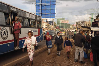 Commuters in the rapidly-urbanizing town of Ruaka, outside Nairobi, Kenya on March 28, 2023 (Hannah Reyes Morales/The New York Times)