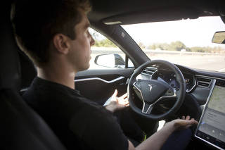 FILE PHOTO: New Autopilot features are demonstrated in a Tesla Model S during a Tesla event in Palo Alto