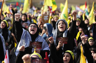 Hezbollah supporters gather to attend a ceremony to honour fighters killed in the recent escalation with Israel, in Beirut
