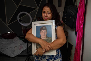 Maria Gilma Cubillos, the widow of a Colombian soldier Barrios who died while fighting in Ukraine, in Neiva, Colombia, Aug. 28, 2023. (Federico Rios/The New York Times)
