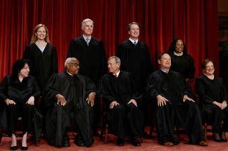 FILE PHOTO: U.S. Supreme Court justices pose for their group portrait at the Supreme Court in Washington