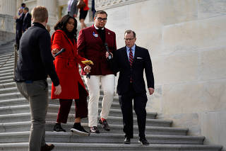 Members of the U.S. House of Representatives leave the Capitol after a series of votes, in Washington