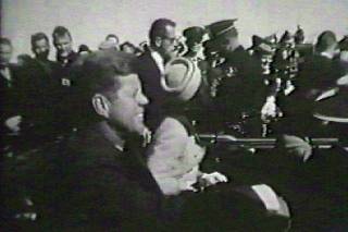 FILE TELEVISION FOOTAGE OF JOHN F. KENNEDY IN LIMO MOMENTS BEFORE ASSASSINATION