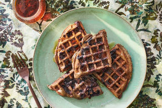 Buckwheat blueberry waffles in New York, April 6, 2023. Food styled by Roscoe Betsill. Props styled by Paige Hicks. (Kelly Marshall/The New York Times)