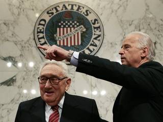 Senate Foreign Relations Committee Chairman Biden directs former U.S. Secretary of State Kissinger during a hearing on Capitol Hill in Washington
