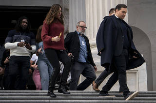 George Santos, the New York Republican facing federal fraud charges, exits the U.S. Capitol building after being expelled from Congress following a bipartisan vote by his peers, in Washington on Friday, Dec. 1, 2023. (Haiyun Jiang/The New York Times)
