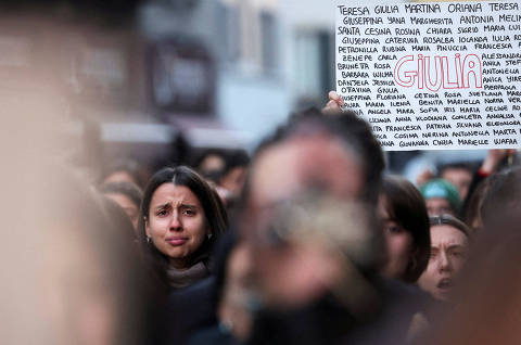 A woman reacts, as students perform a flash mob to protest against feminicide and violence against women, following 22-years-old Giulia Cecchettin's murder, outside University of Milan, in Milan, Italy, November 22, 2023. REUTERS/Claudia Greco     TPX IMAGES OF THE DAY ORG XMIT: GGG-CGR107