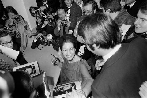 (FILES) American singer of Greek origin Maria Callas (C) signs autographs for her fans after her last recital at the Theatre des Champs Elysees in Paris on December 7, 1973. 100 years ago, on December 2, 1923, Maria Callas was born in New York. Here are a few key moments in the life of the 