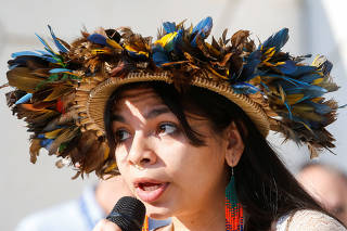 Walelasoetxeige Paiter Bandeira Surui, addresses Climate activists from the Pacific at a protest during the United Nations Climate Change Conference in Dubai