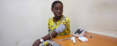 Nkem Azinge, a government project manager, during a checkup at National Hospital in Abuja, Nigeria, on Dec. 5, 2023. There is no clear path for African patients to get access to the treatments, which have multimillion-dollar price tags and are highly complex to manufacture and deliver. (Taiwo Aina/The New York Times) ORG XMIT: XNYT0539