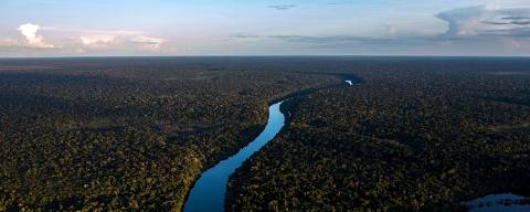 (FILES) In this file aerial view taken on June 7, 2022 the Manicore river is pictured, deep inside the Amazonia rainforest, Amazonas state, Brazil. - The One Forest Summit, a summit dedicated to the protection of tropical forests, opens on March 1, 2023 in Libreville, Gabon with the aim of finding 