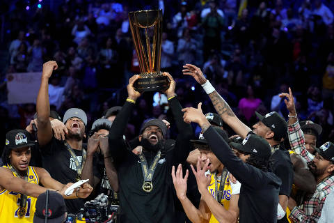 Dec 9, 2023; Las Vegas, Nevada, USA; Los Angeles Lakers forward LeBron James (23) celebrates with teammates and the NBA Cup after defeating the Indiana Pacers in the in season tournament championship final at T-Mobile Arena. Mandatory Credit: Kyle Terada-USA TODAY Sports     TPX IMAGES OF THE DAY ORG XMIT: IMAGN-742241