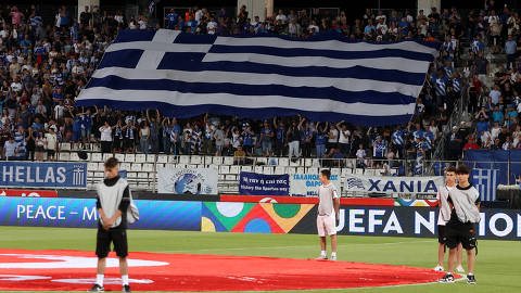 Soccer Football - UEFA Nations League - Group J - Greece v Kosovo - Panthessaliko Stadio, Volos, Greece - June 12, 2022 Greece fans with flag inside the stadium before the match REUTERS/Alexandros Avramidis