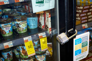 A locked ice cream freezer at a CVS pharmacy in New York, on Jan. 9, 2022. (Gabby Jones/The New York Times)