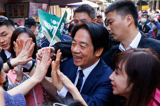 Lai Ching-te, Taiwan's vice president and the ruling Democratic Progressive Party's (DPP) presidential candidate interacts with supporters in Taipei