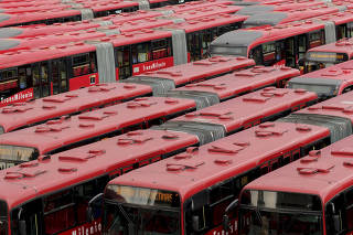 A yard full TransMilenio system buses in Bogotá, Colombia, April 11, 2023. (Felipe Romero Beltran/The New York Times)