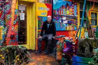 Marios Orozco, a Christiania resident since 1981, in front of his gallery and home. ÒPeople in Christiania are all people who didnÕt fit into society somehow,Ó he says.  (Betina Garcia/The New York Times)