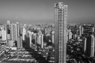 Vista aerea do Edificio Figueira Altos do Tatuape de 170 metros e da sua  sombra projetada sobre casas e outros edificios menores