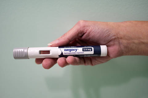 Rebekah Carl poses with her prescription of Wegovy in New Columbia, Pennsylvania, U.S., November 13, 2023. Photo taken on November 13, 2023. REUTERS/Hannah Beier ORG XMIT: HFS-PH023
