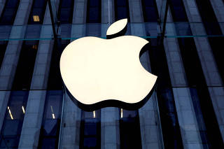 FILE PHOTO: The Apple logo is seen hanging at the entrance to the Apple store on 5th Avenue in Manhattan, New York, U.S., October 16, 2019. REUTERS/Mike Segar/