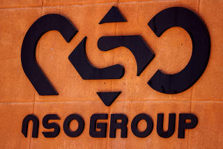 FILE PHOTO: The logo of Israeli cyber firm NSO Group is seen at one of its branches in the Arava Desert, southern Israel