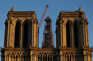 A new rooster is prepared to be installed at the top of the spire of the Notre-Dame de Paris Cathedral