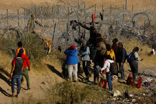 Migrants try to reach the United States from Mexico, in Ciudad Juarez