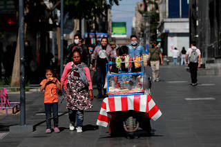 FILE PHOTO: A street vendor is seen on the street as the outbreak of the coronavirus disease (COVID-19) continues in Mexico City