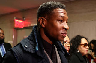 Actor Jonathan Majors arrives with Meagan Good for the jury selection in his  assault and harassment case at Manhattan Criminal Court in New York City