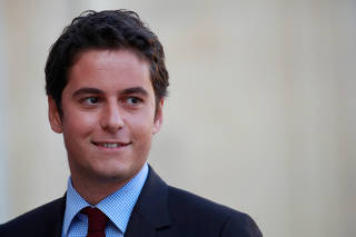 FILE PHOTO: Gabriel Attal, newly-named French Junior Education Minister, arrives to attend to attend the weekly cabinet meeting at the Elysee Palace in Paris