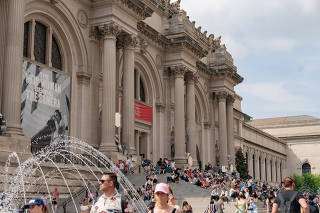FILE PHOTO: People stand outside The Metropolitan Museum of Art in New York City