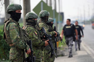 Soldiers keep watch outside the Zonal 8 prison in Guayaquil