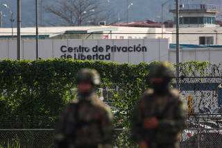 Soldiers stand outside the Zonal 8 prison in Guayaquil