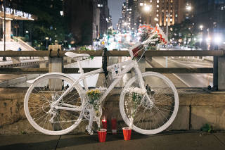 A bicycle painted white is used as a memorial for Félix Patricio Teófilo by 47th Street and First Avenue in Manhattan, near where he was killed, Sept. 25, 2023. (Jeenah Moon/The New York Times)
