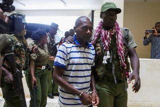 Paul Mackenzie, a Kenyan cult leader accused of ordering his followers, who were members of the Good News International Church, to starve themselves to death in Shakahola forest, is escorted to the Malindi Law Courts