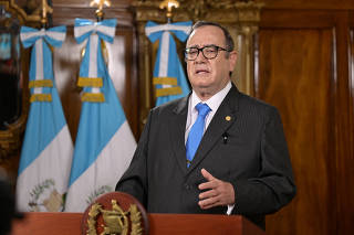 Guatemala President Alejandro Giammattei delivers a video message