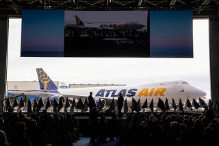 FILE PHOTO: Boeing employees and executives attend the delivery of the final 747 jet in Everett