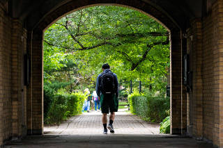 FILE PHOTO: Students walk on the grounds of the University of Toronto in Toronto