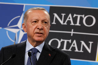FILE PHOTO: Turkish President Recep Tayyip Erdogan speaks at a press conference during a NATO summit in Madrid,