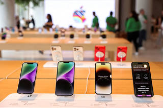 FILE PHOTO: Apple iPhones are seen inside India's first Apple retail store, a day ahead of its launch, in Mumbai