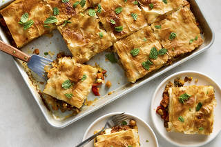 Stewed vegetables hide beneath a crisp layer of phyllo dough in this burnished vegetarian main. Food Stylist: Barrett Washburne. (Ryan Liebe/The New York Times)