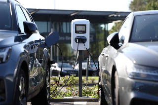 A view shows an Energy Powerwall Home Battery at a charging station near a car dealer store, in Brussels
