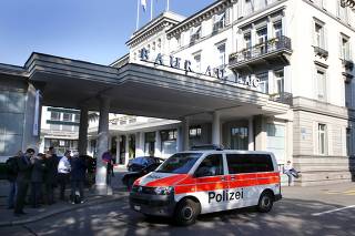 A police van drives past the Baur au Lac hotel in Zurich