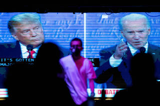 FILE PHOTO: People watch the second 2020 presidential campaign debate between Democratic presidential nominee Joe Biden and U.S. President Donald Trump at The Abbey Bar during the outbreak of the coronavirus disease (COVID-19), in West Hollywood