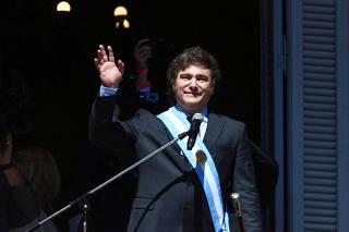 FILE PHOTO: Argentina's President Milei's waves to crowd after swearing-in ceremony in Buenos Aires