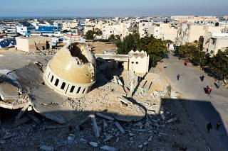 A mosque destroyed in Israeli strikes during the conflict lies in ruin, in Khan Younis