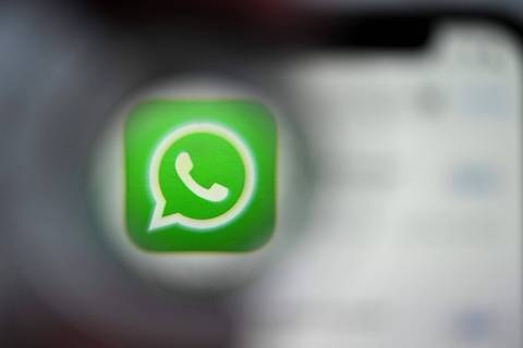 This illustration photograph taken on December 22, 2023, shows the logo of US instant messaging software Whatsapp displayed on a smartphone's screen, in Frankfurt am Main, western Germany. (Photo by Kirill KUDRYAVTSEV / AFP)