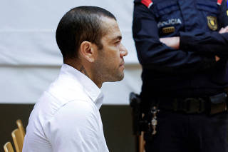 FILE PHOTO: Brazil soccer player Dani Alves sits in court during the first day of his trial in Barcelona
